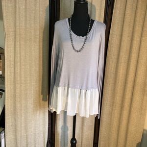 Gray long sleeve with white around bottom. Size large. By freebird. Very nice.